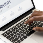 Businessman using computer laptop at work